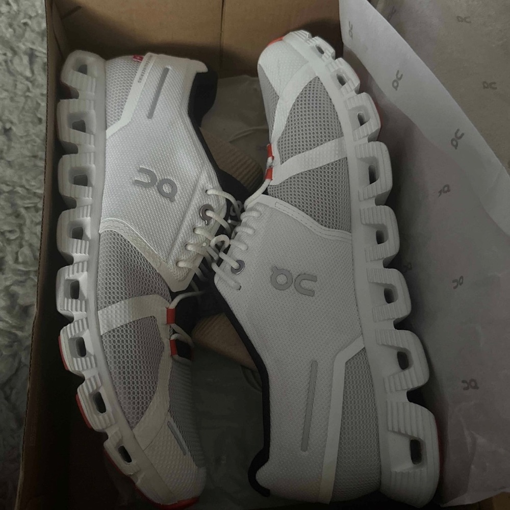 White and red On cloud running shoes